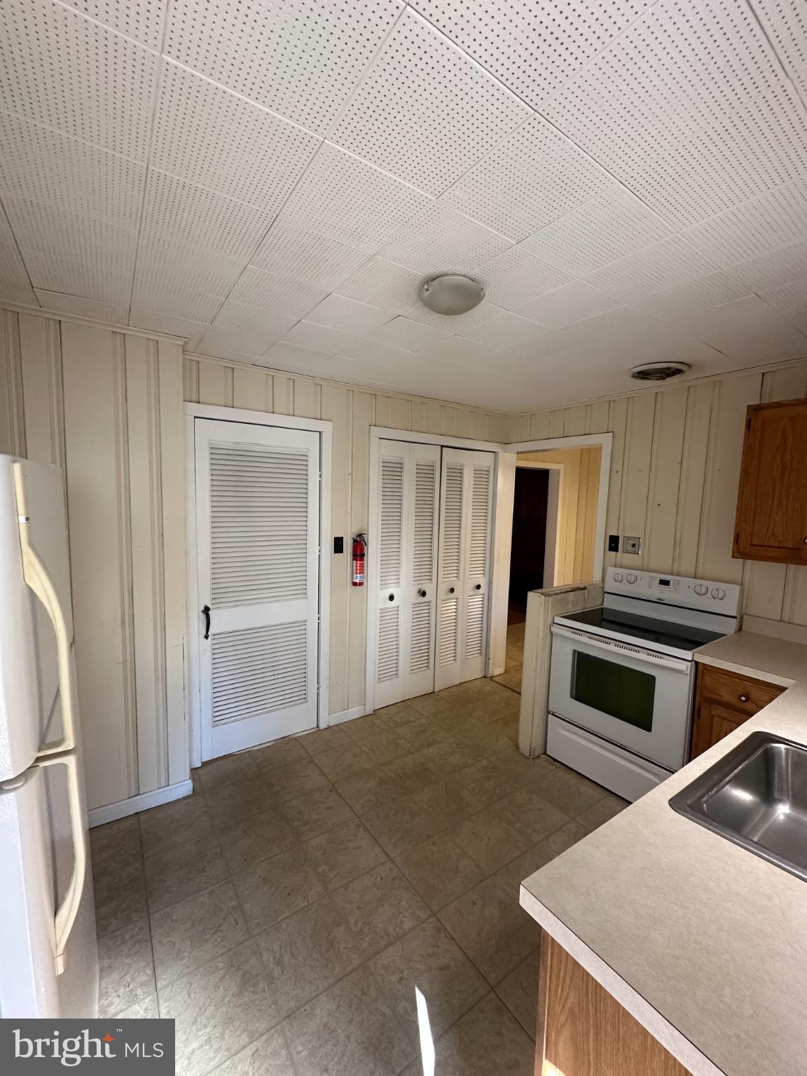 809 Somerdale Road Voorhees, NJ 08043 - Photo 7 of 20 a kitchen with a stove and a refrigerator
