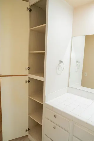 a bathroom with a shower and a sink