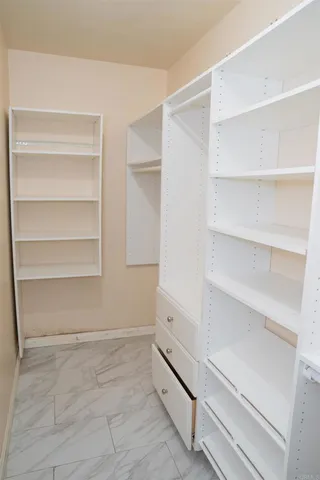 a view of an empty walk in closet