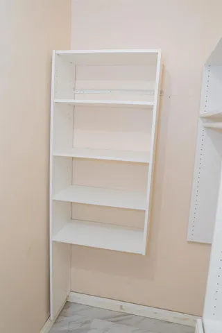 a view of an empty walk in closet