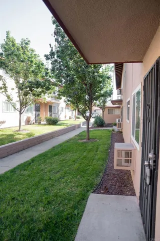 a view of a yard and front view of a house
