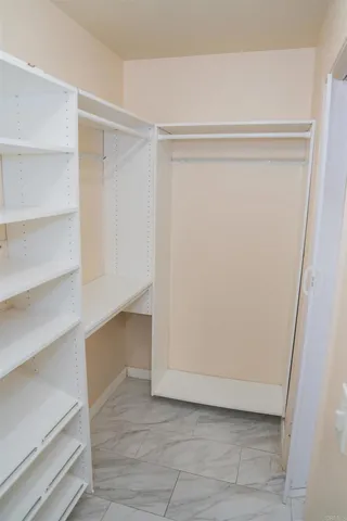 a view of an empty walk in closet