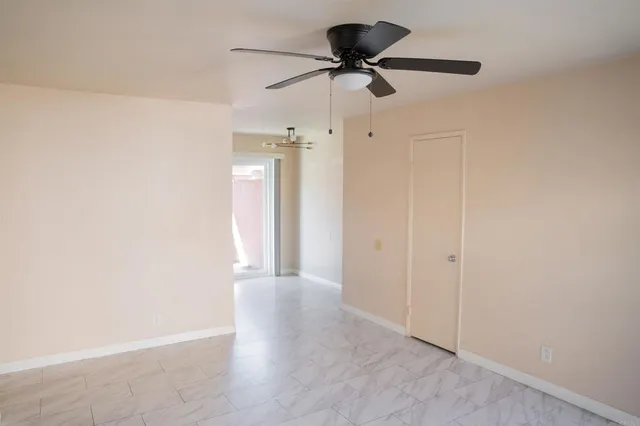 a view of an empty room and wooden floor