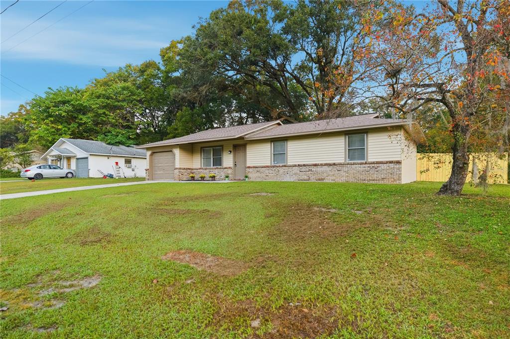 3753 Southeast 67th Place Ocala, FL 34480 - Photo 27 of 30 a front view of house with yard and green space