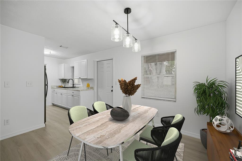 3753 Southeast 67th Place Ocala, FL 34480 - Photo 10 of 30 a kitchen with a table and chairs in it