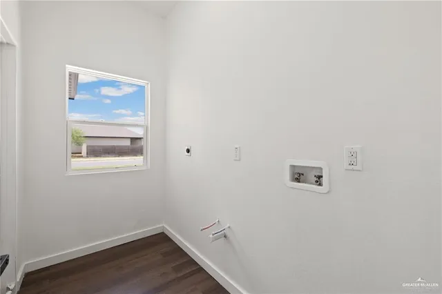 a room with a wooden floor and a window