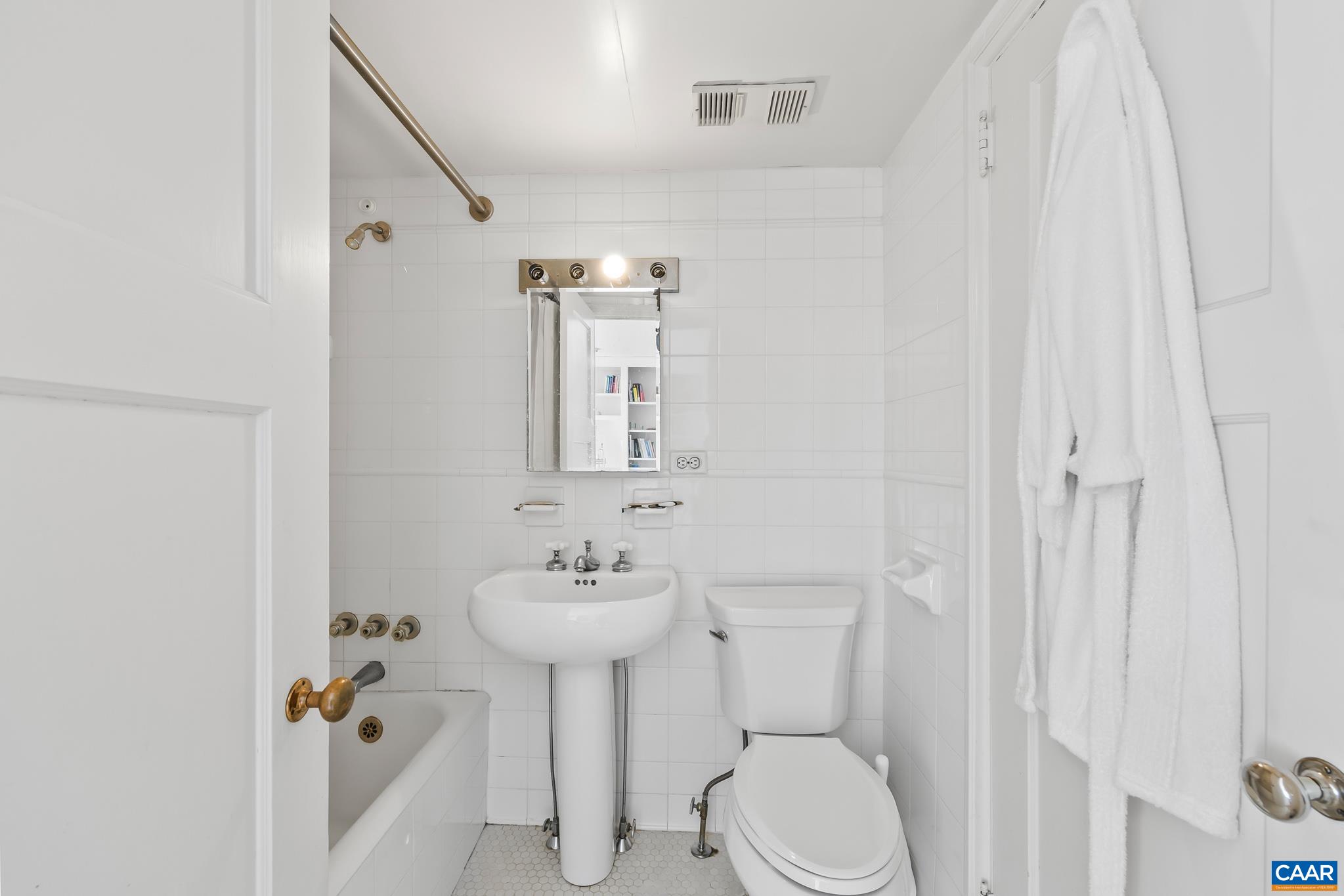 500 Court Square, Unit 505 Charlottesville, VA 22902 - Photo 14 of 16 a bathroom with a sink toilet