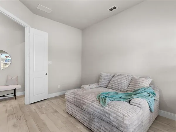 a kitchen with stainless steel appliances granite countertop a table chairs refrigerator and a stove