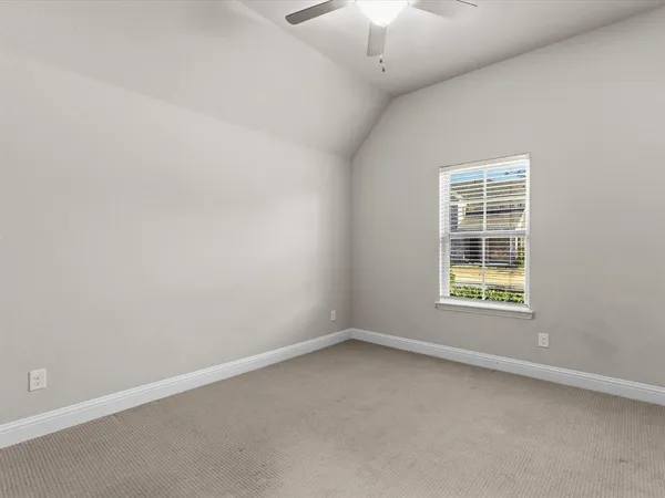 a view of an empty room with a flat screen tv