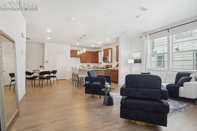 a living room with furniture and a large window