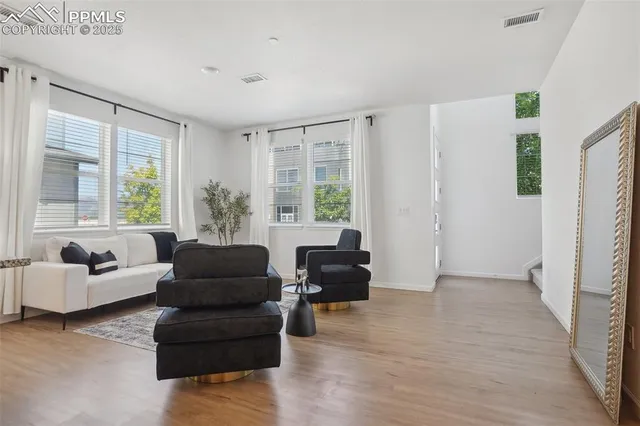 a living room with furniture and windows