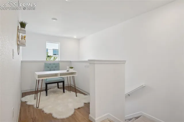 a workspace with furniture and window