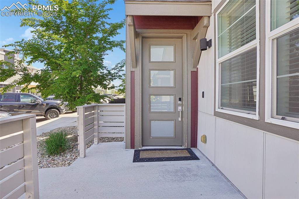 1743 Spring Water Point Colorado Springs, CO 80908 - Photo 6 of 35 a view of front door of house