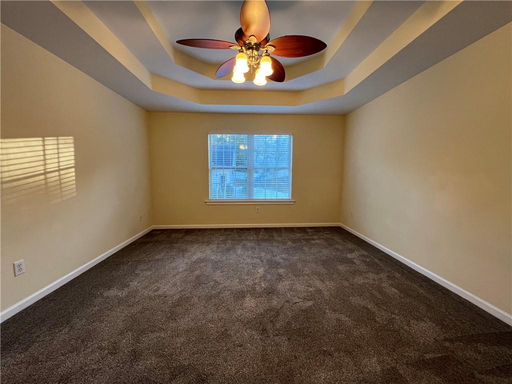 2705 Waymar Drive Southwest Marietta, GA 30008 - Photo 12 of 28 a view of an empty room and window and chandelier fan