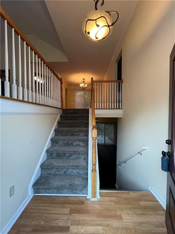 a view of entryway with wooden floor