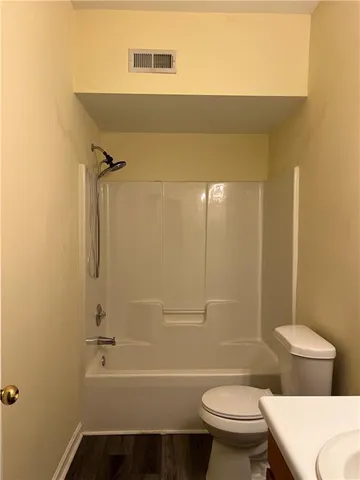 a bathroom with a sink a mirror and a shower