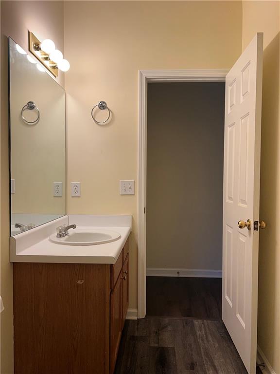 2705 Waymar Drive Southwest Marietta, GA 30008 - Photo 22 of 28 a bathroom with a sink a mirror and a shower