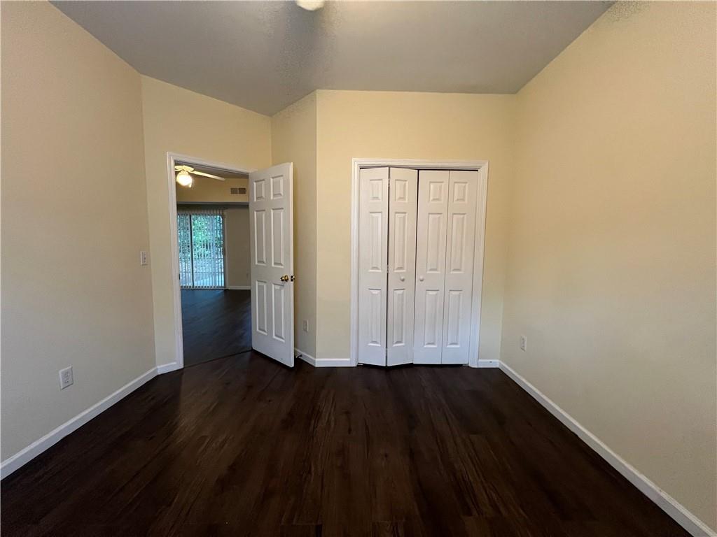 2705 Waymar Drive Southwest Marietta, GA 30008 - Photo 23 of 28 an empty room with wooden floor and closet