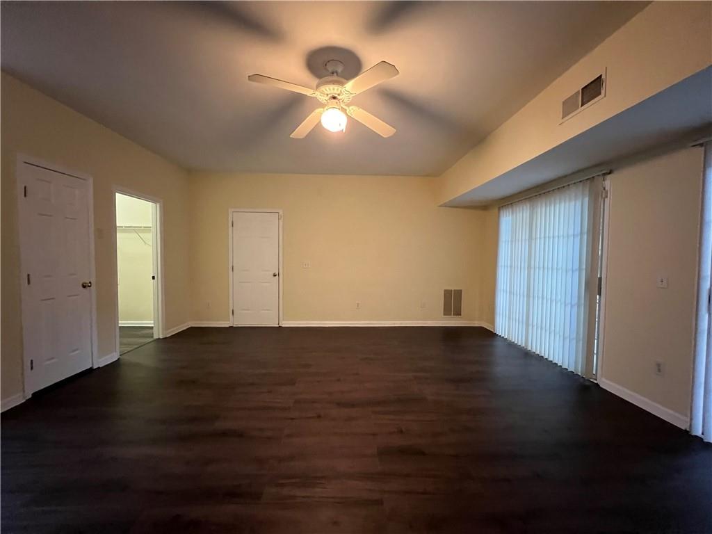 2705 Waymar Drive Southwest Marietta, GA 30008 - Photo 27 of 28 an empty room with wooden floor and windows