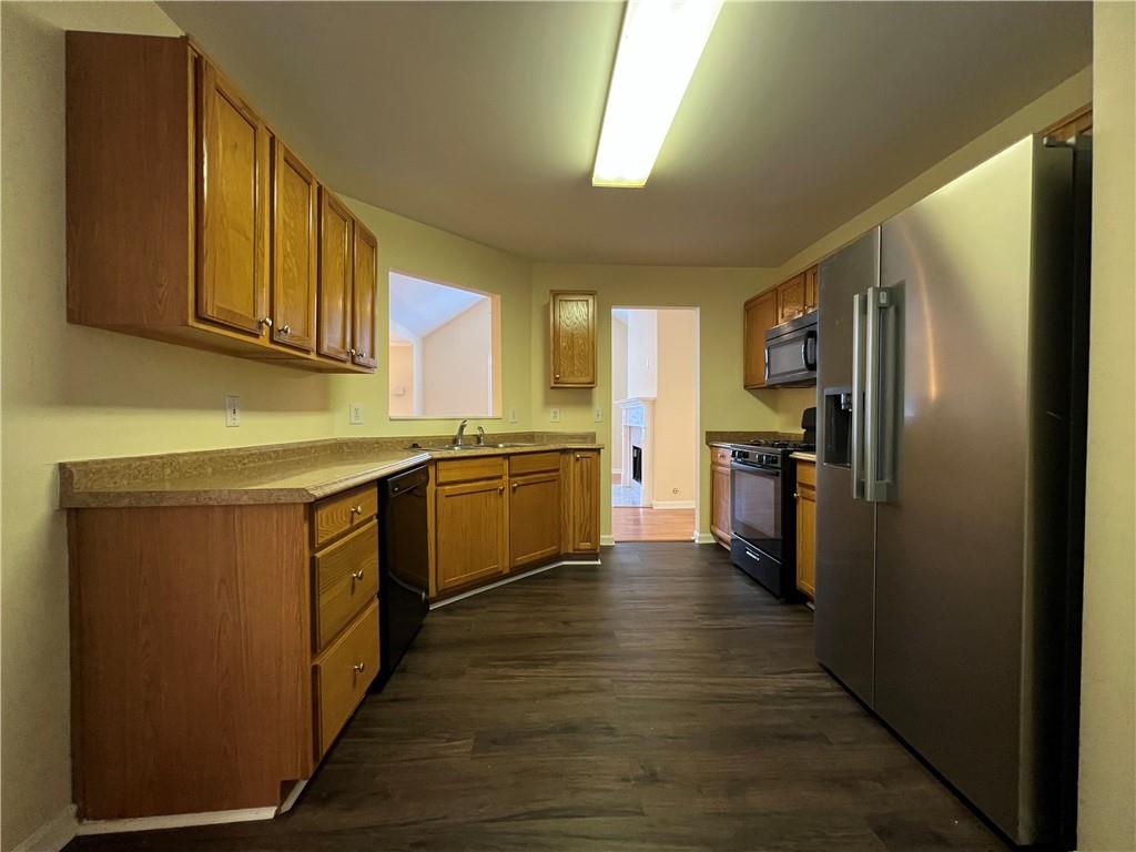 2705 Waymar Drive Southwest Marietta, GA 30008 - Photo 8 of 28 a kitchen with cabinets stainless steel appliances and a window