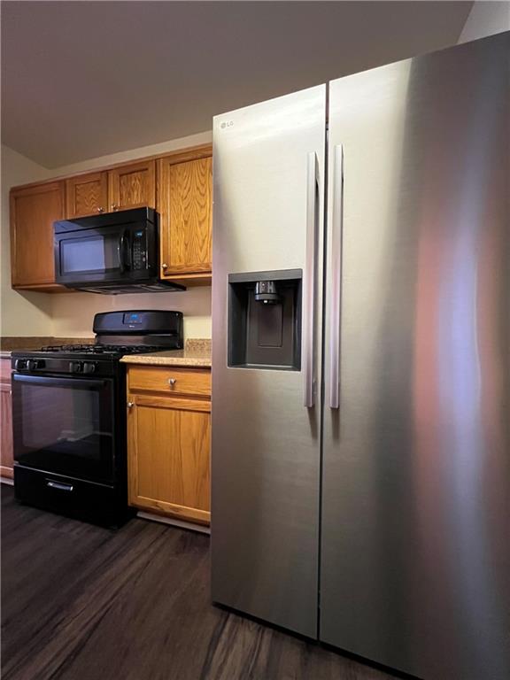 2705 Waymar Drive Southwest Marietta, GA 30008 - Photo 9 of 28 a kitchen with granite countertop a refrigerator and a stove top oven