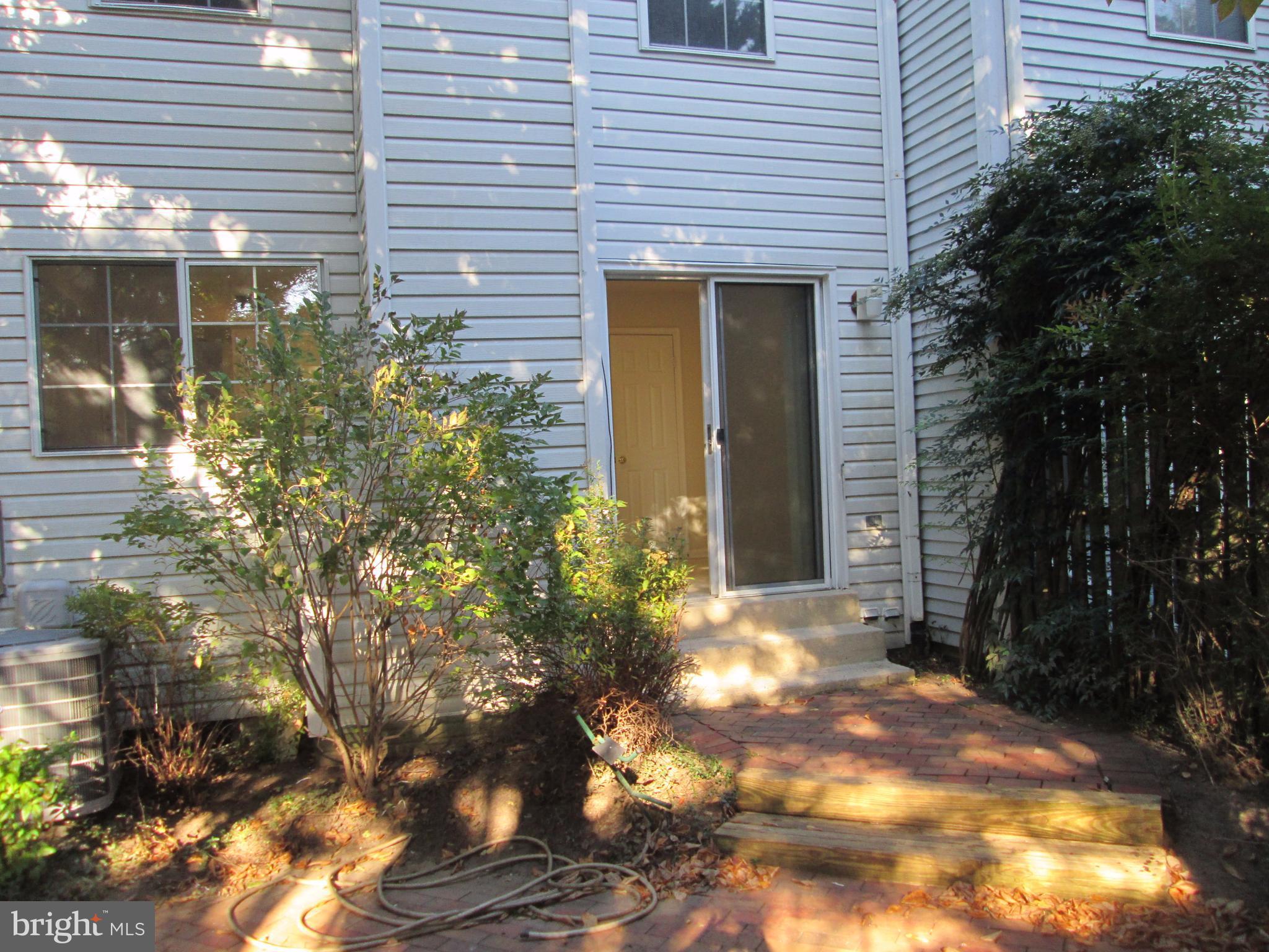 2201 Wimbledon Circle Silver Spring, MD 20906 - Photo 17 of 28 Brick, fenced, and private patio