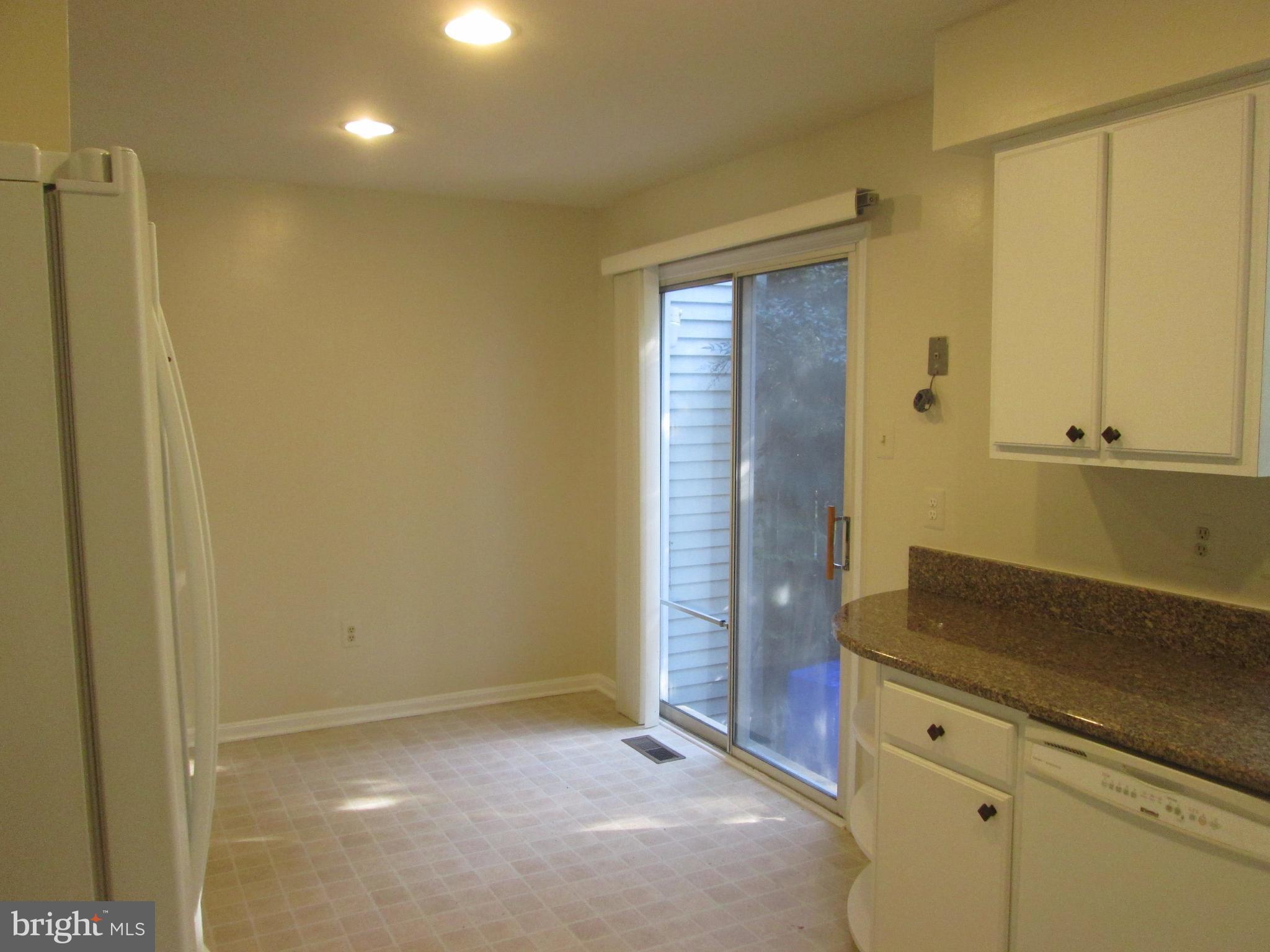 2201 Wimbledon Circle Silver Spring, MD 20906 - Photo 2 of 28 with breakfast room leading to private fenced deck