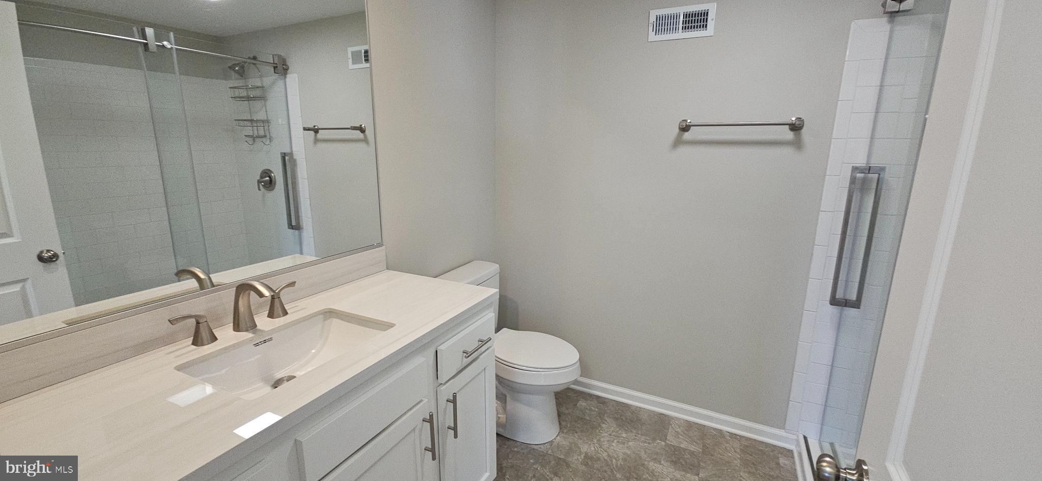 232 Myrtle Avenue Winchester, VA 22601 - Photo 11 of 36 a bathroom with a sink toilet and shower