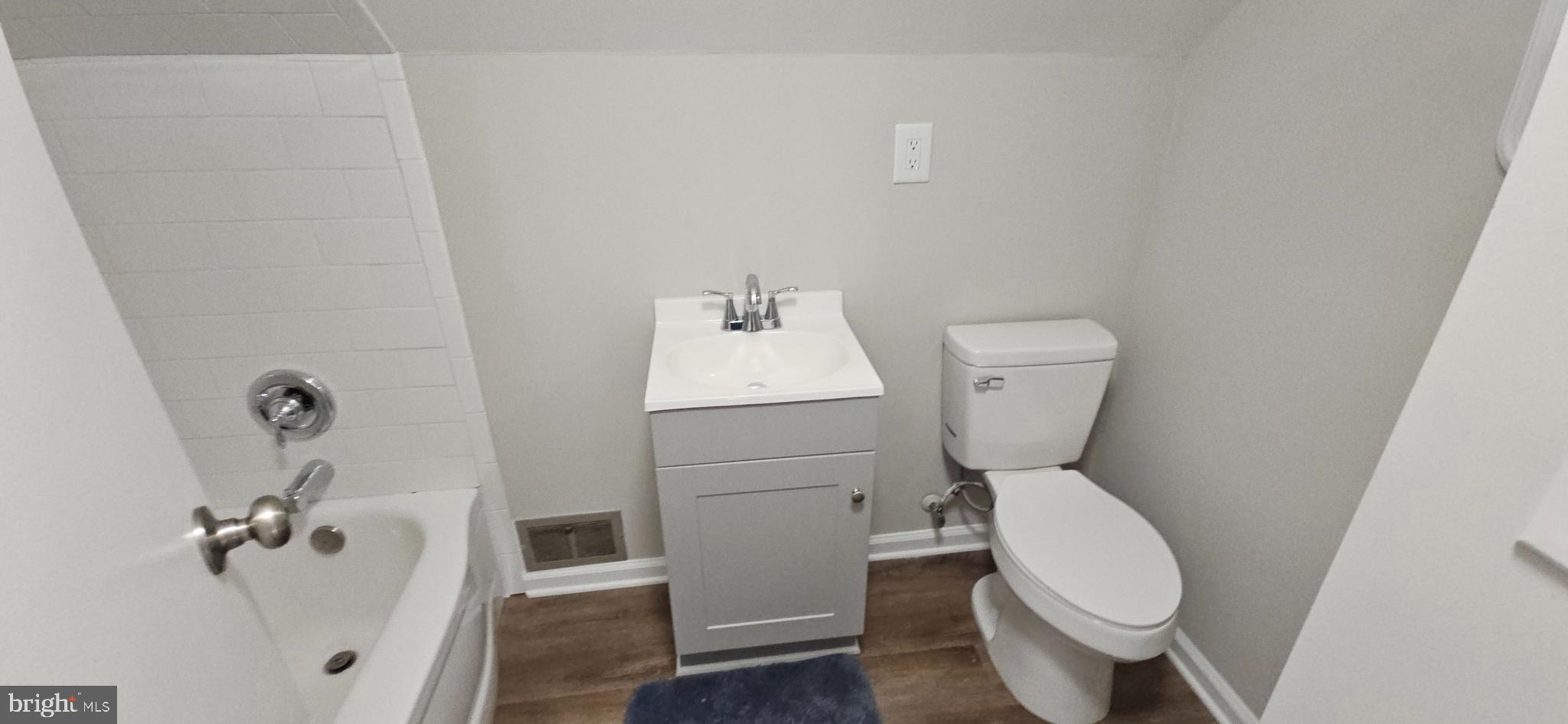 232 Myrtle Avenue Winchester, VA 22601 - Photo 20 of 36 a white toilet sitting next to a bathroom sink
