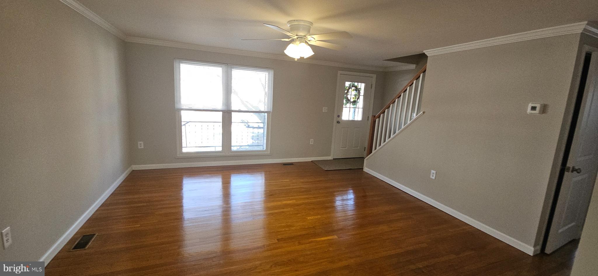 232 Myrtle Avenue Winchester, VA 22601 - Photo 5 of 36 wooden floor in an empty room with a window