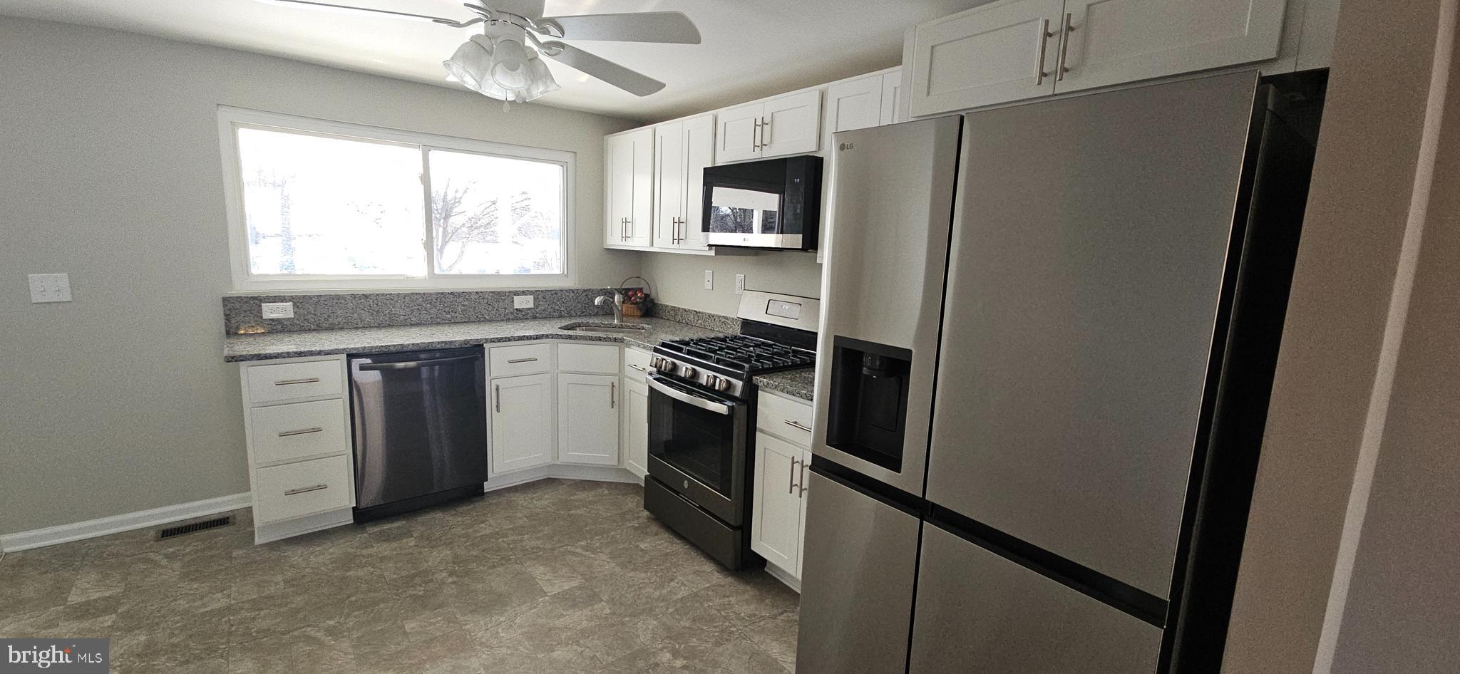 232 Myrtle Avenue Winchester, VA 22601 - Photo 9 of 36 a kitchen with a refrigerator stove and microwave