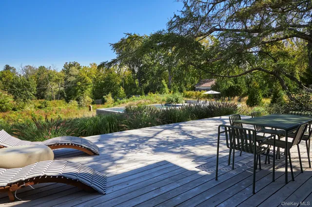 a living room with furniture a fireplace and a chandelier
