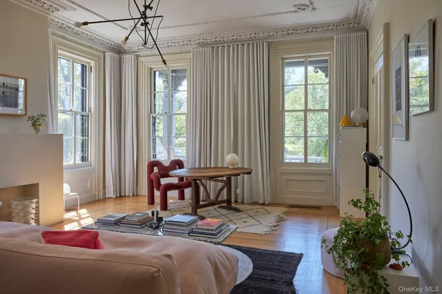 a view of a dining room with furniture window and outside view