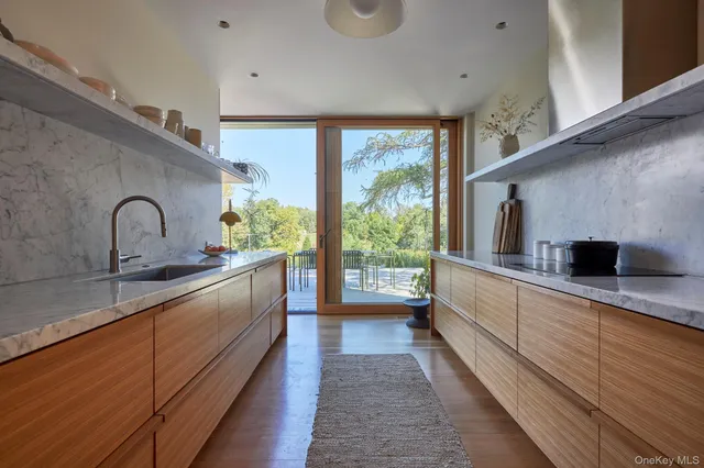a kitchen with a sink and a window