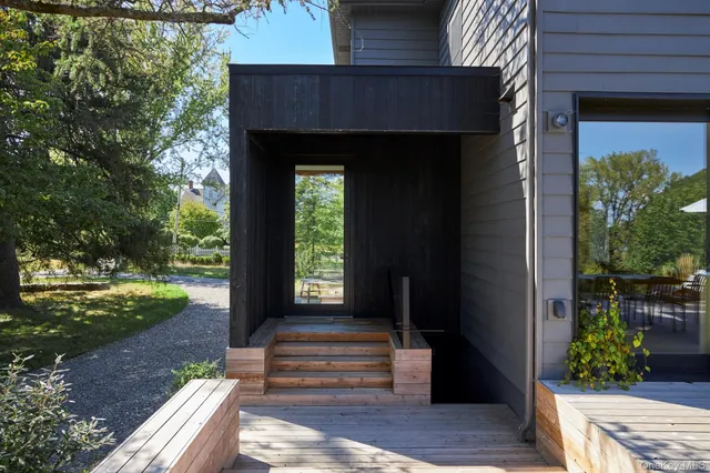 a view of a patio with a table and chairs
