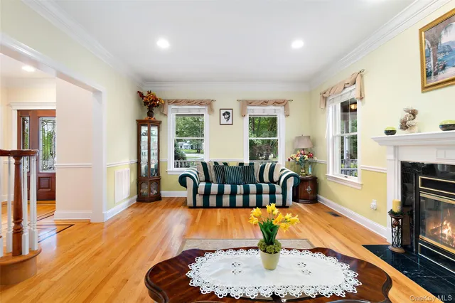 a living room with furniture fireplace and flat screen tv