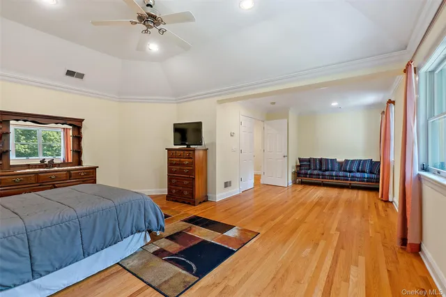 a bedroom with bed and window