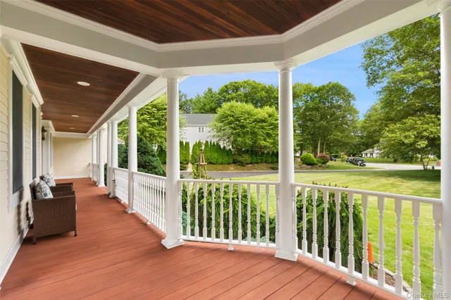 a view of a porch with wooden floor and outdoor space