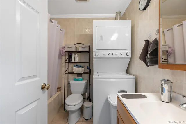 a bathroom with a toilet sink and shower