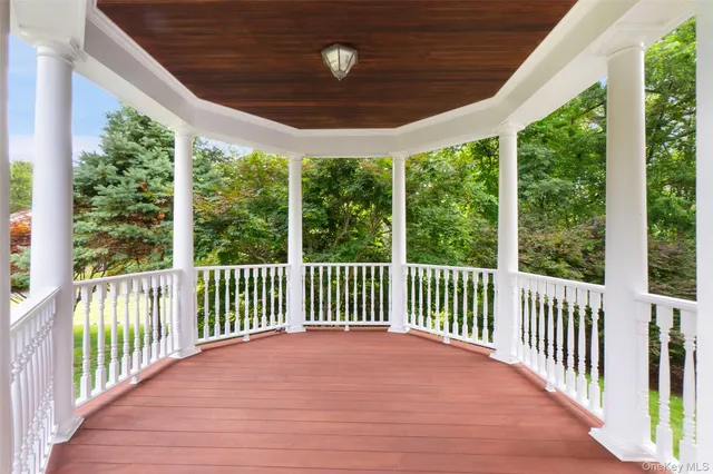 a view of a porch with wooden floor and outdoor space
