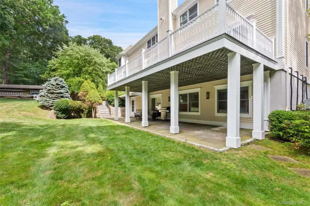 a view of a house with backyard porch and garden