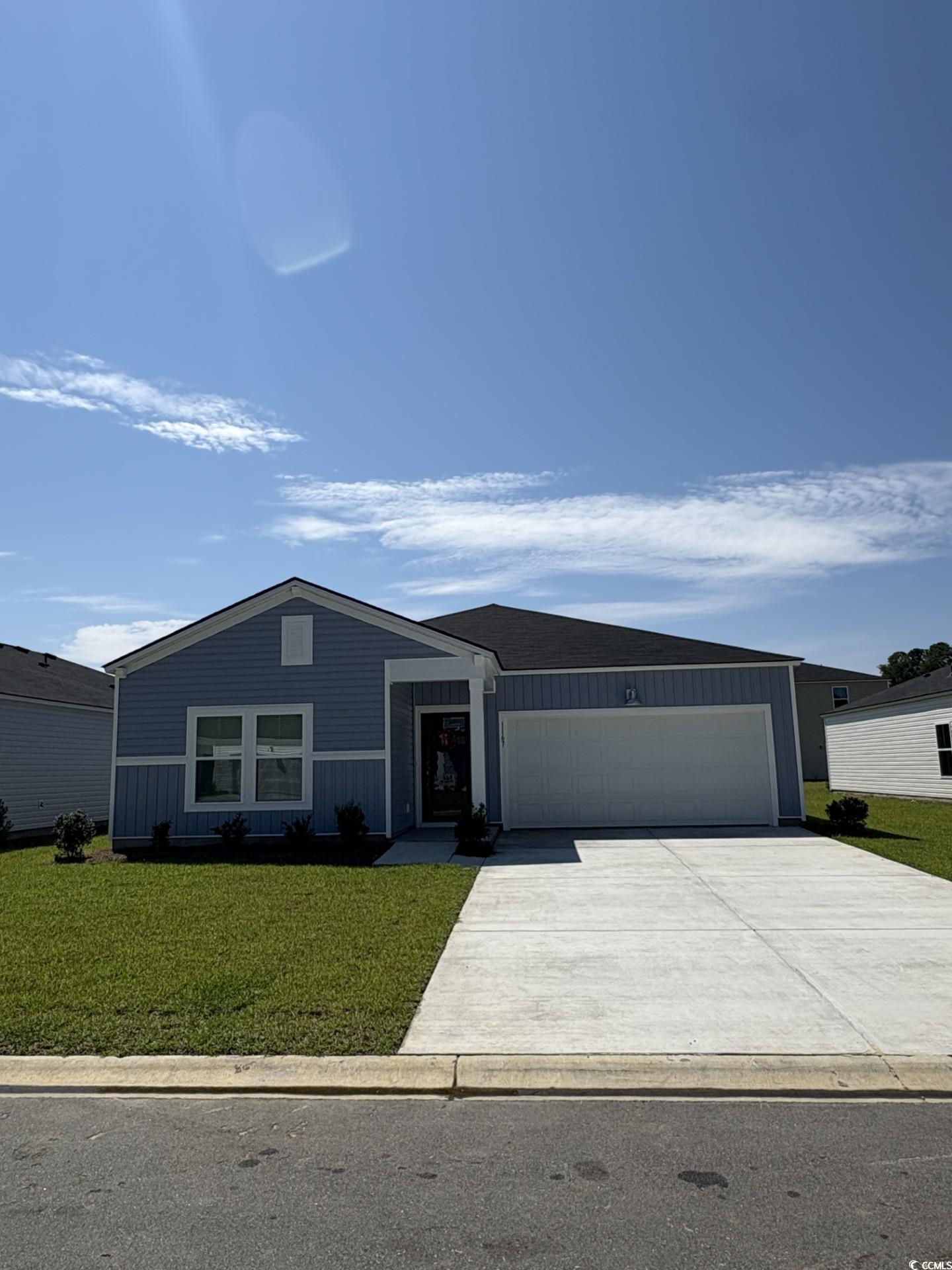 View of front of property featuring an attached ga