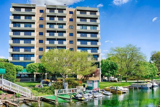 101 Broad Street, Unit 504 Lake Geneva, WI 53147 - Photo 1 of 1 a view of building with outdoor space and lake view