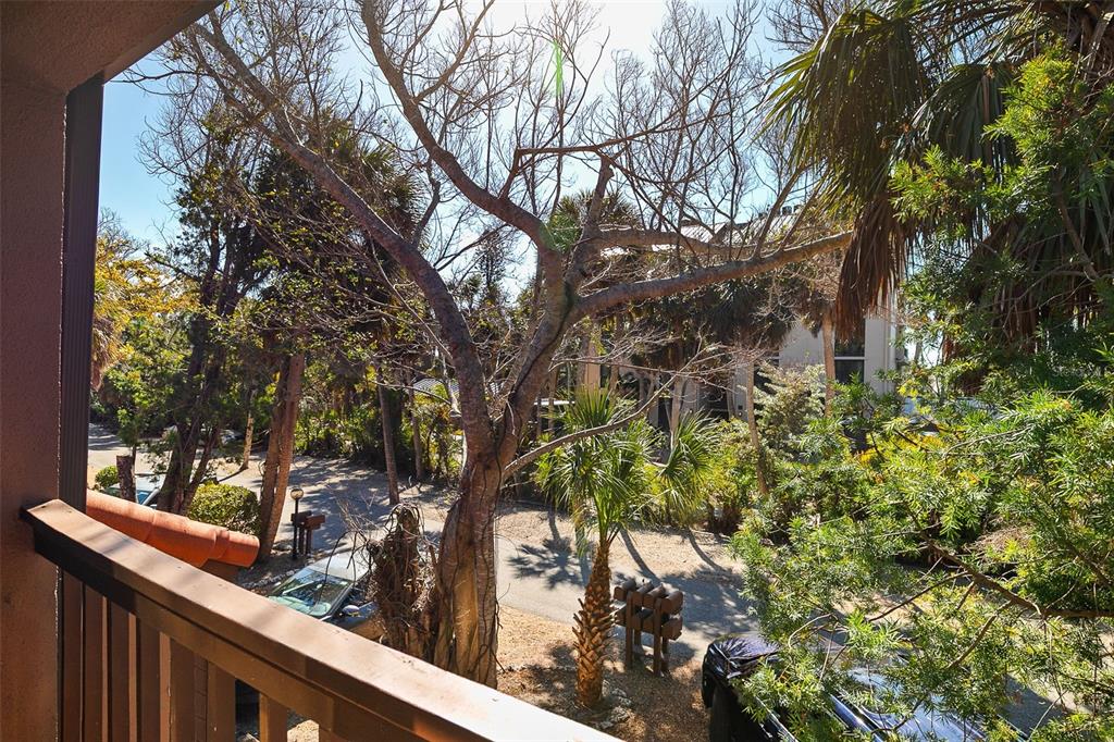 208 Pass Key Road, Unit 208 Sarasota, FL 34242 - Photo 11 of 29 a view of a wooden street from a balcony