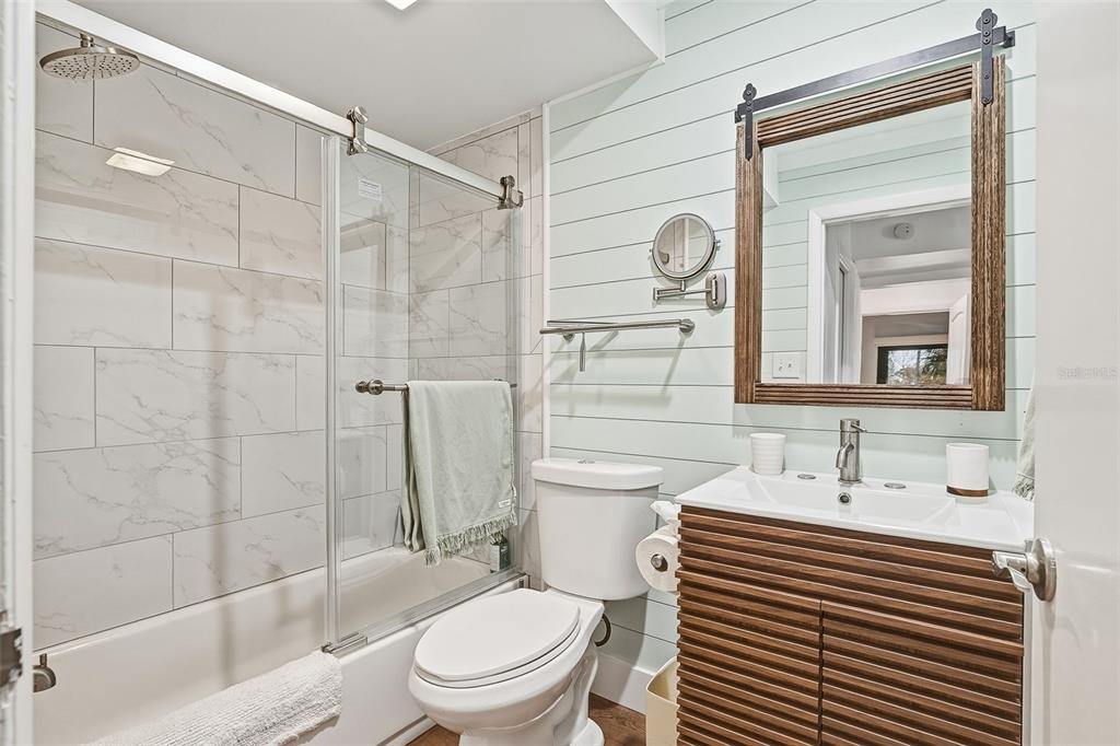 208 Pass Key Road, Unit 208 Sarasota, FL 34242 - Photo 16 of 29 a bathroom with a sink a toilet and shower