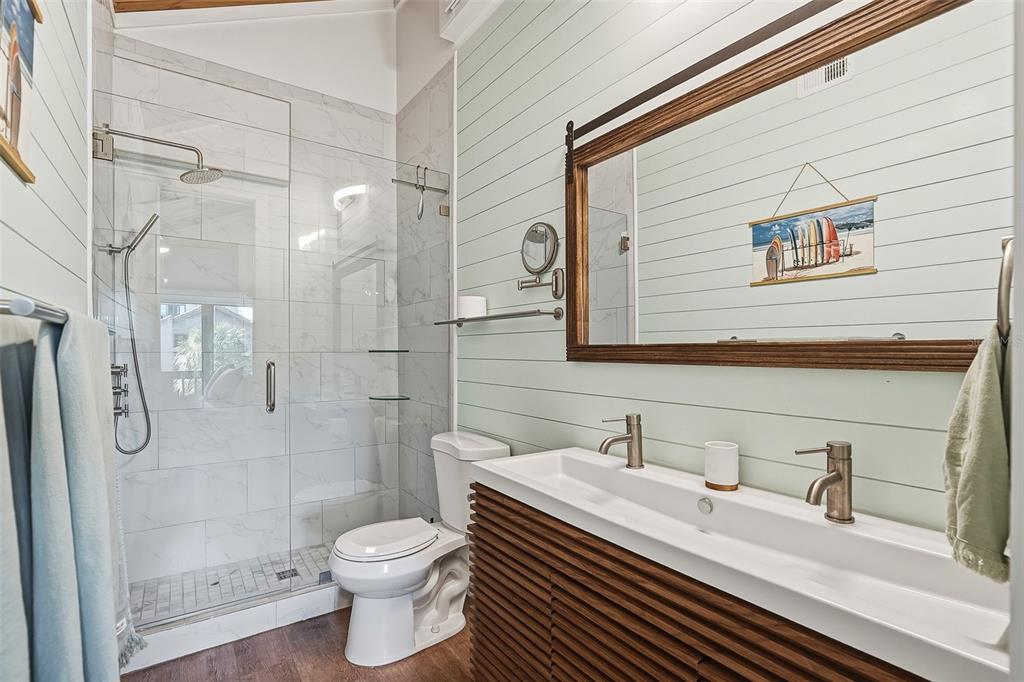 208 Pass Key Road, Unit 208 Sarasota, FL 34242 - Photo 21 of 29 a bathroom with a granite countertop sink toilet and shower
