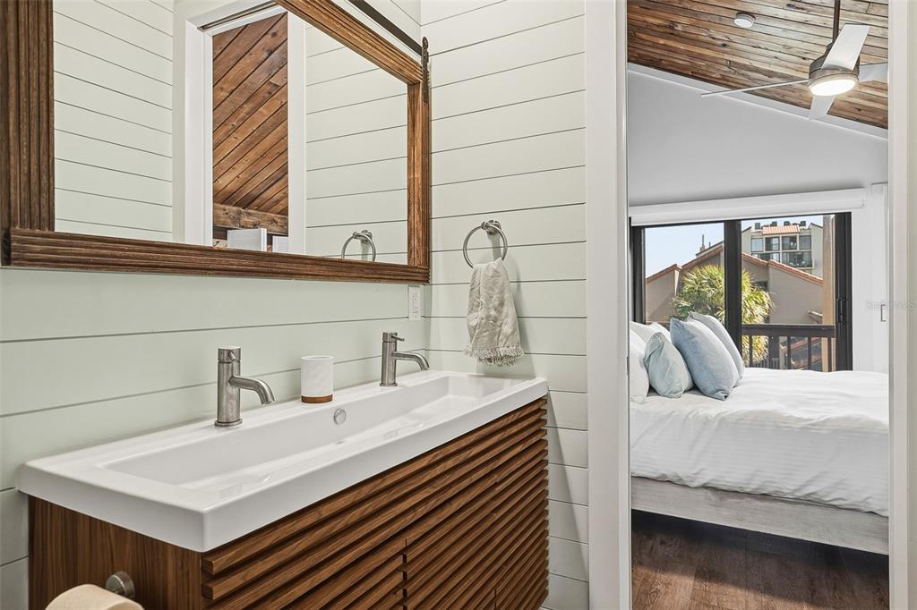 208 Pass Key Road, Unit 208 Sarasota, FL 34242 - Photo 22 of 29 a bathroom with a sink and a mirror