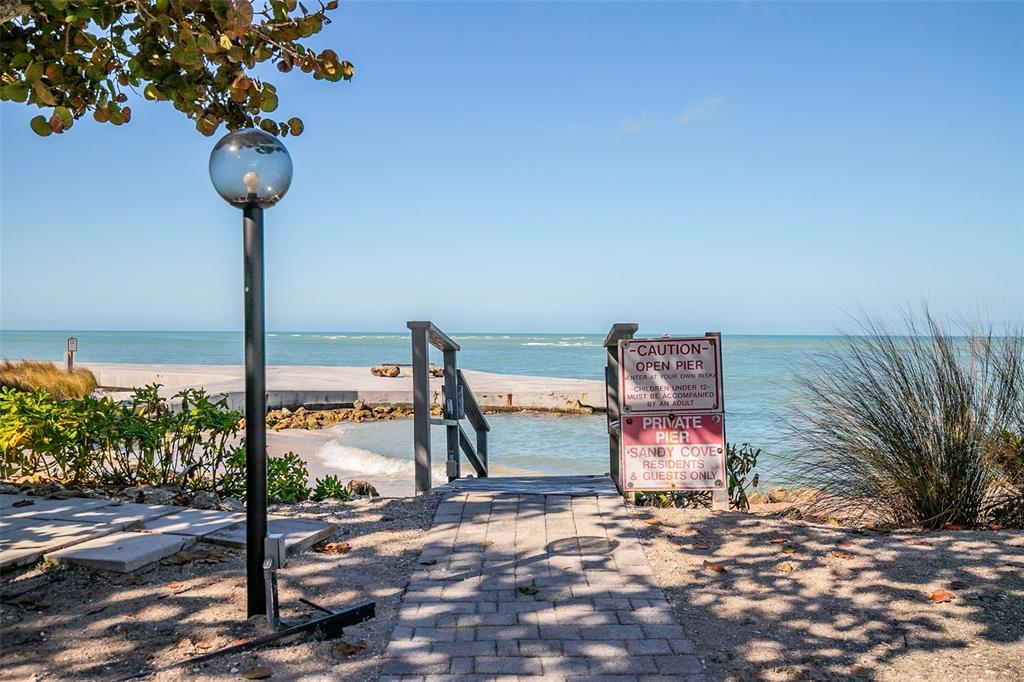208 Pass Key Road, Unit 208 Sarasota, FL 34242 - Photo 23 of 29 a street sign sitting on the side of a road