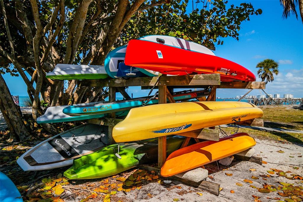 208 Pass Key Road, Unit 208 Sarasota, FL 34242 - Photo 26 of 29 an outdoor space with furniture and umbrella