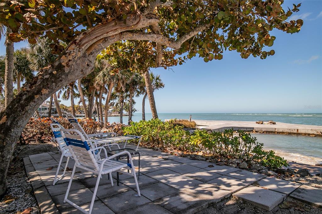 208 Pass Key Road, Unit 208 Sarasota, FL 34242 - Photo 28 of 29 a backyard of a house with lots of green space